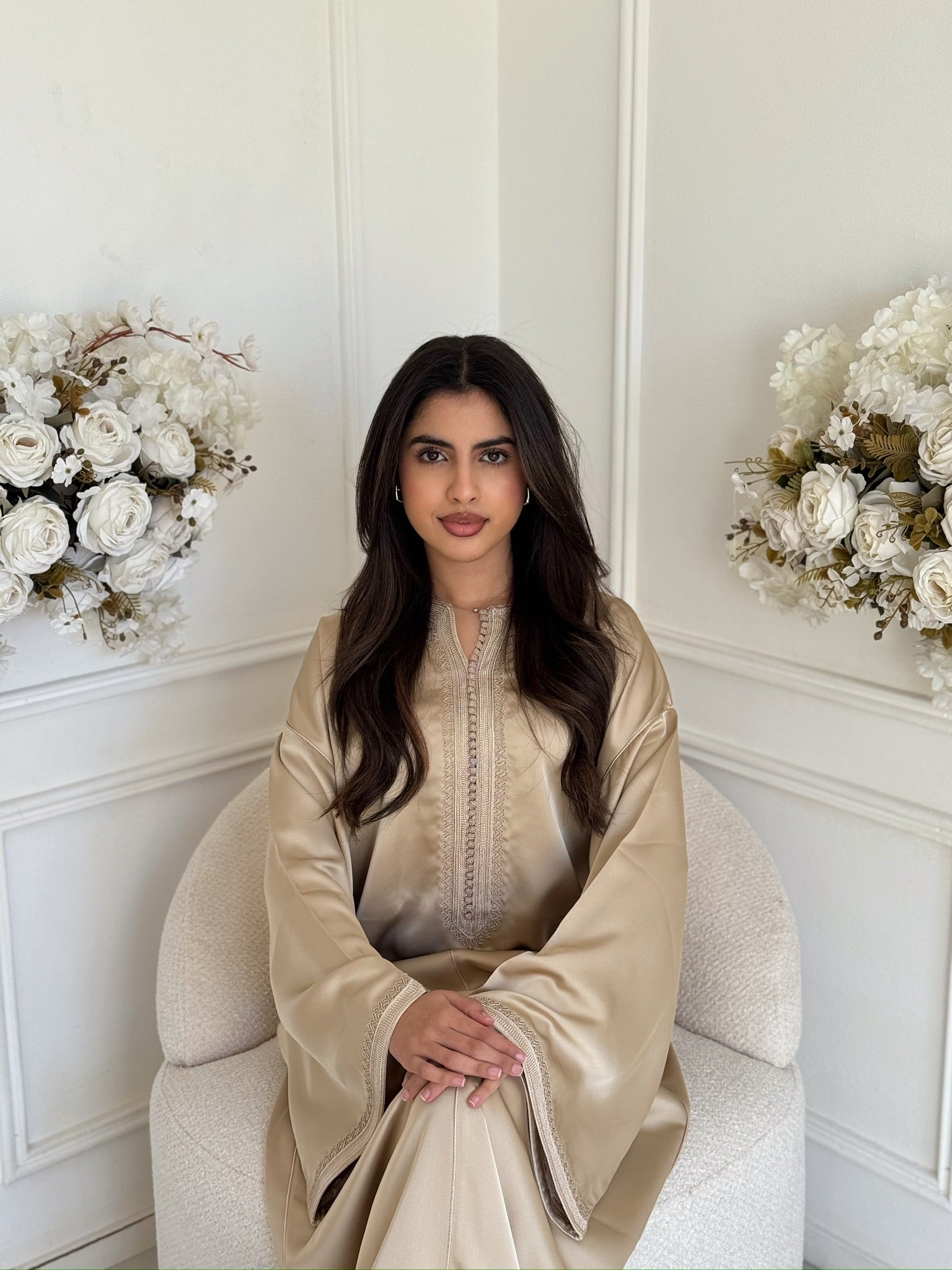 Woman wearing the Gandoura Zayna, a luxury handmade Moroccan gandoura with a soft flowing fit.