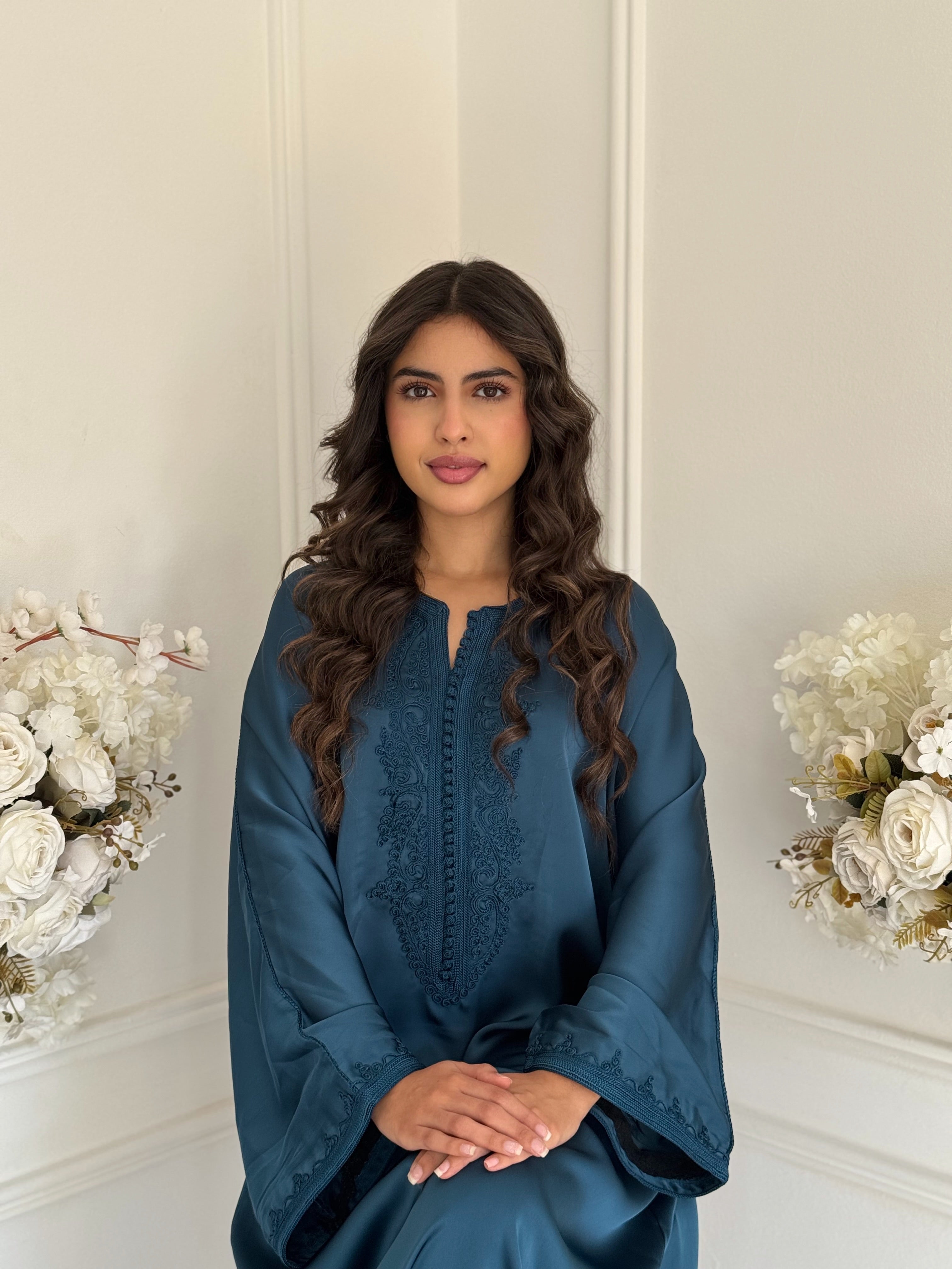 Model wearing the deep blue Gandoura Hafsa Moroccan dress made from drap de soie.
