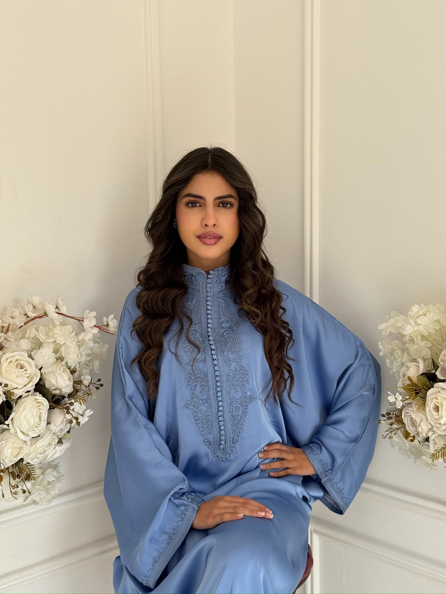Model wearing the light blue Gandoura Zoulaykha Moroccan dress in drap de soie silk.”