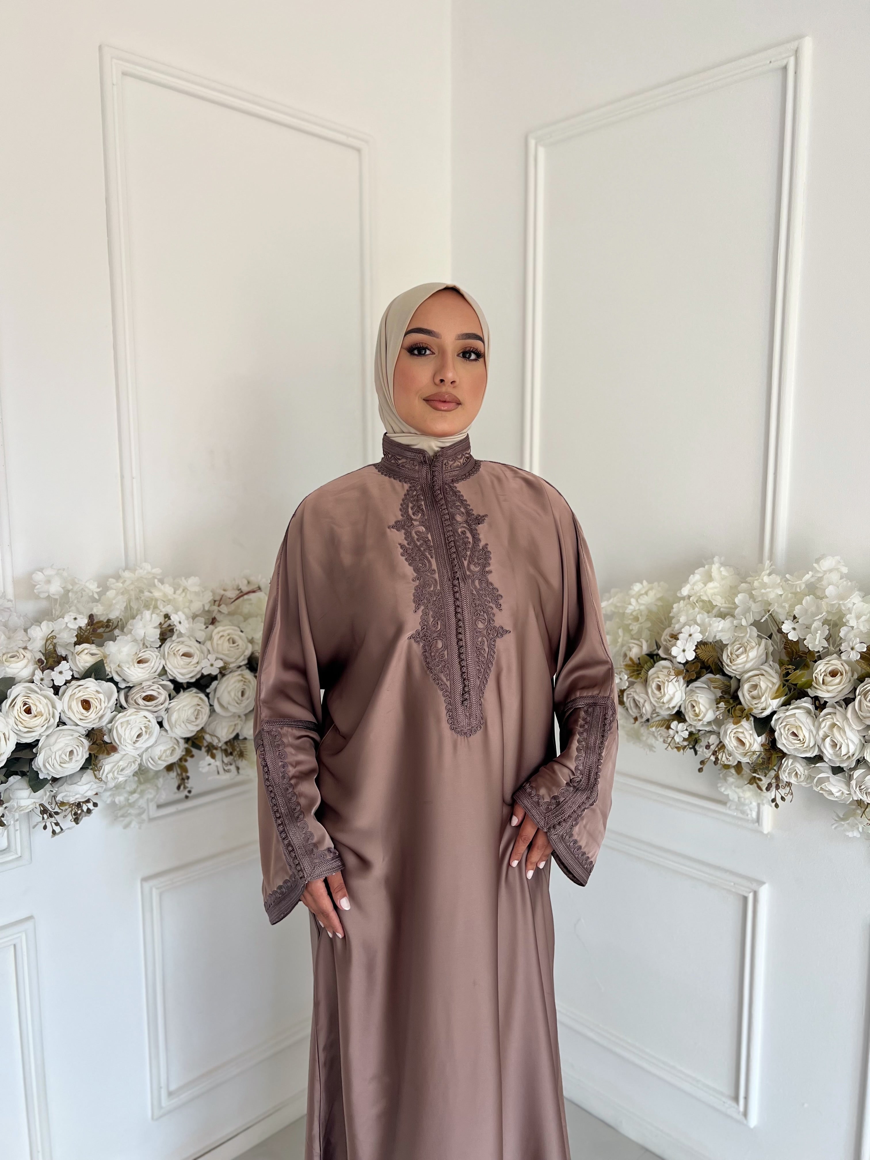 Model wearing Gandoura Oumniya – taupe Moroccan gandoura in silky drap de soie fabric.”