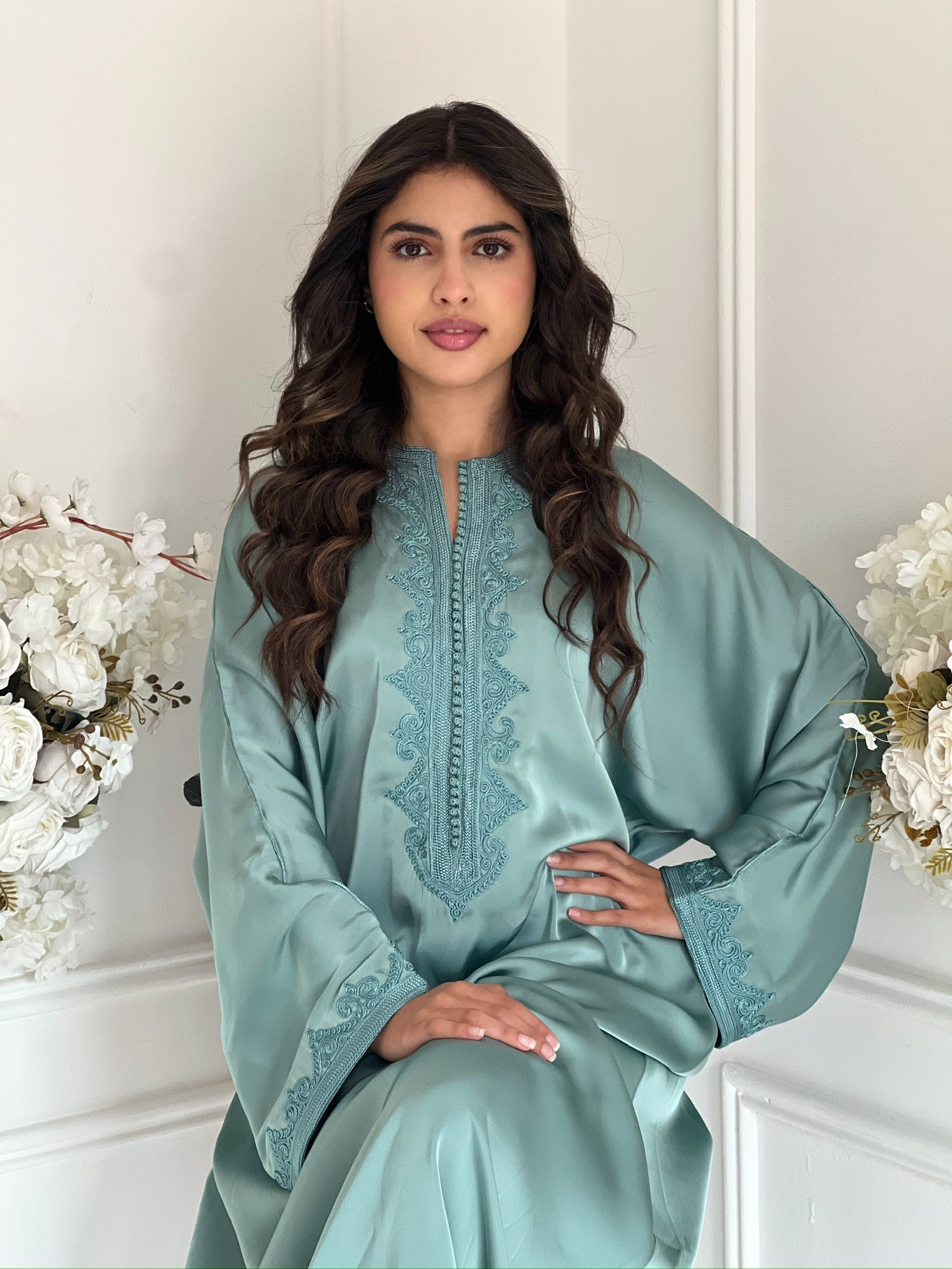 Model wearing the mint green gandoura
 Lina Moroccan dress with embroidered details.