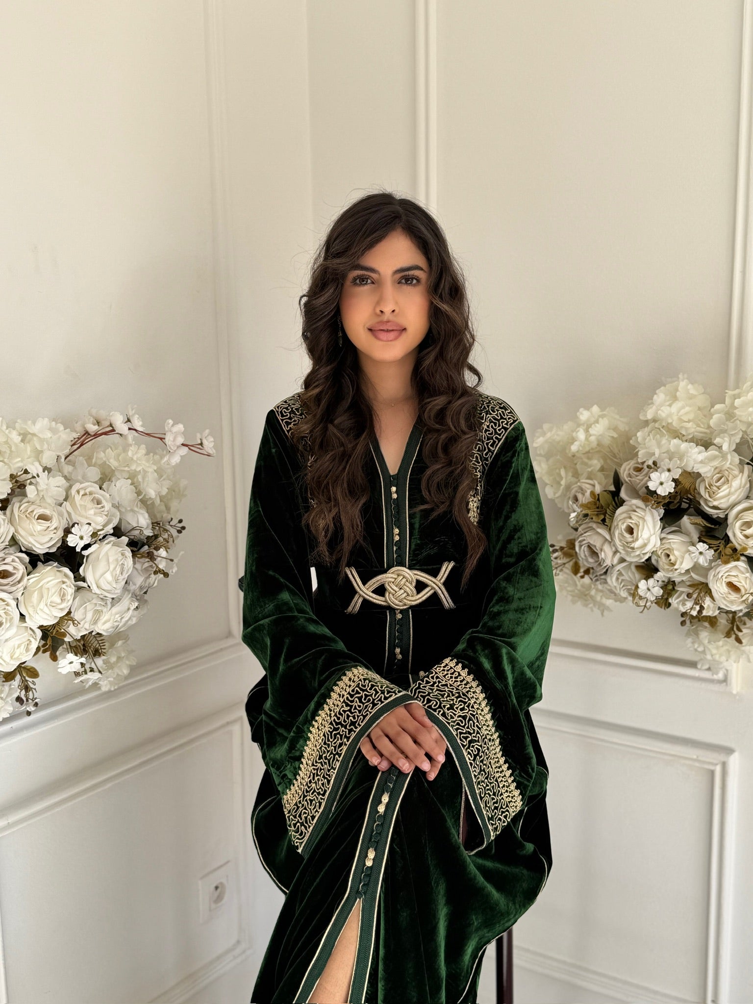 Model wearing Caftan Layla – emerald green one-piece Moroccan caftan with gold embroidery