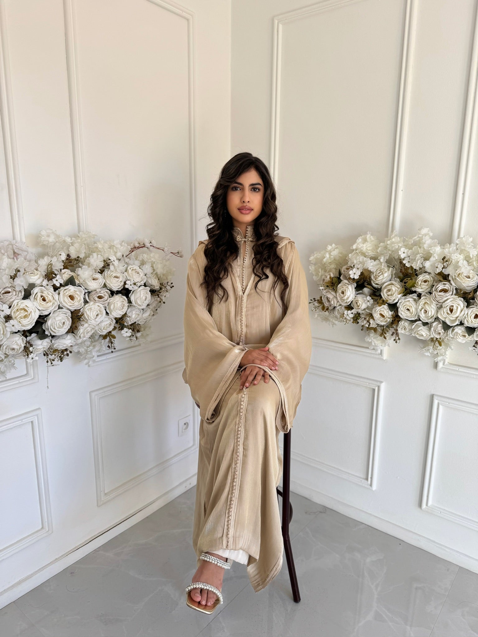 Model wearing Jellaba Dahiba – gold Moroccan jellaba with elegant embroidery