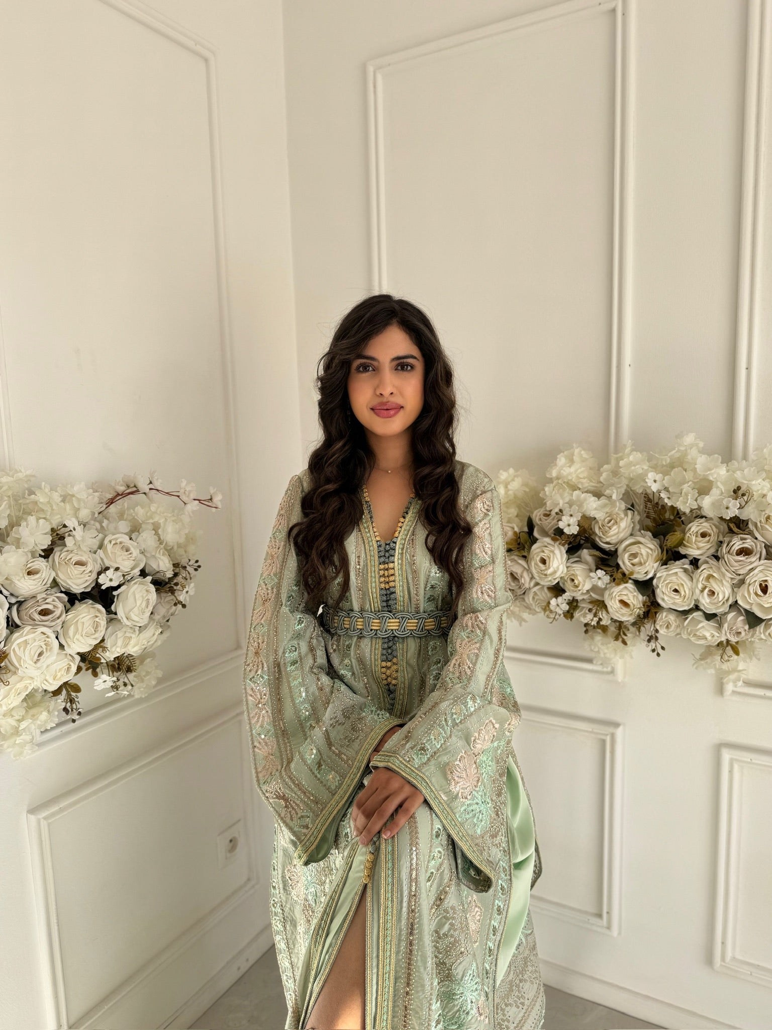 Model wearing Takchita Lamyae – mint green Moroccan takchita in embroidered organza fabric