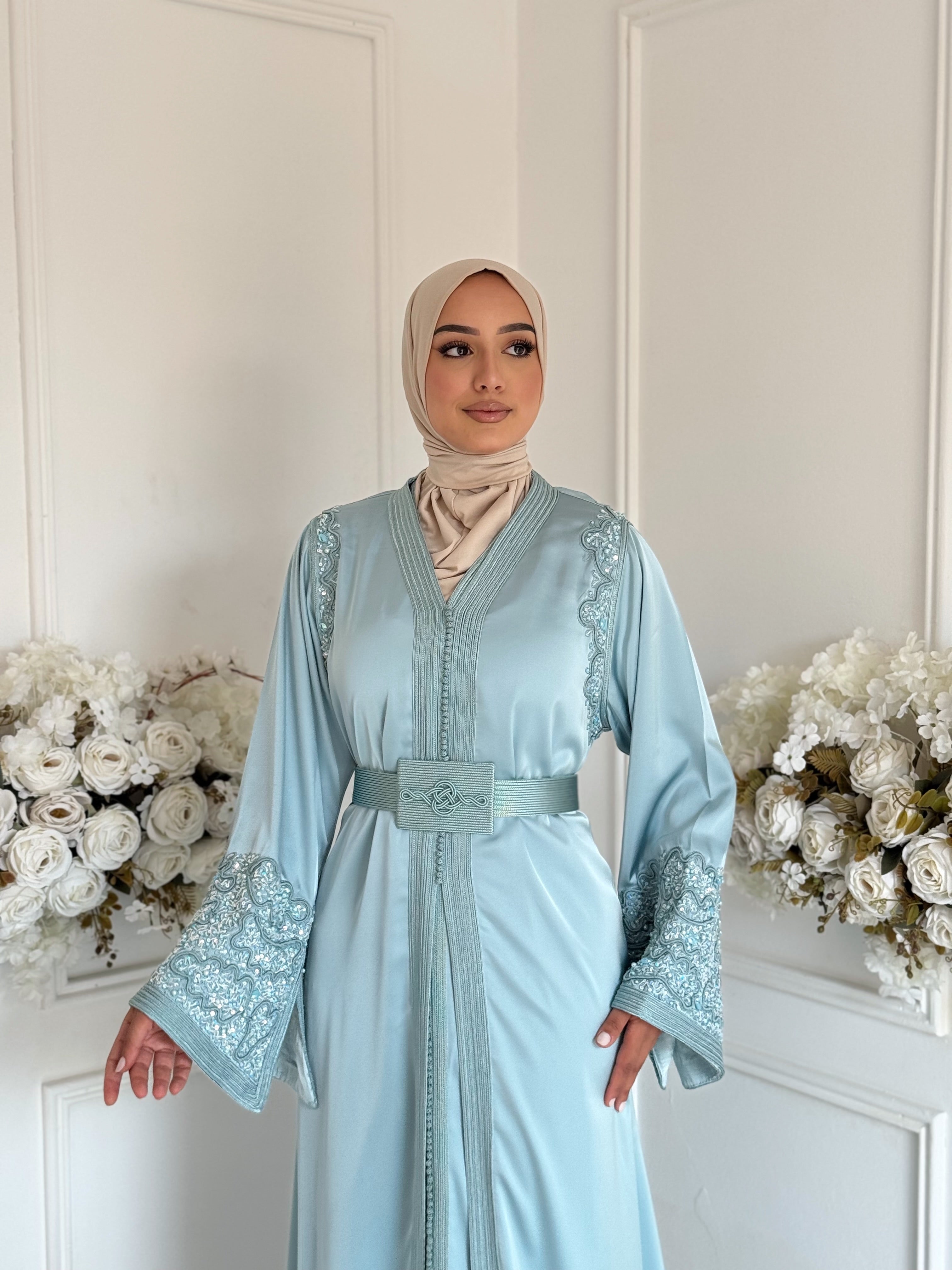 Model wearing Takchita Nour – sky blue Moroccan two-piece dress with subtle embroidery