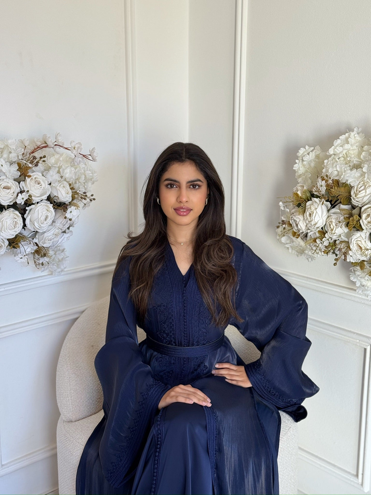 Woman wearing the Takchita Minaya, a luxury handmade Moroccan takchita with elegant flowing layers.