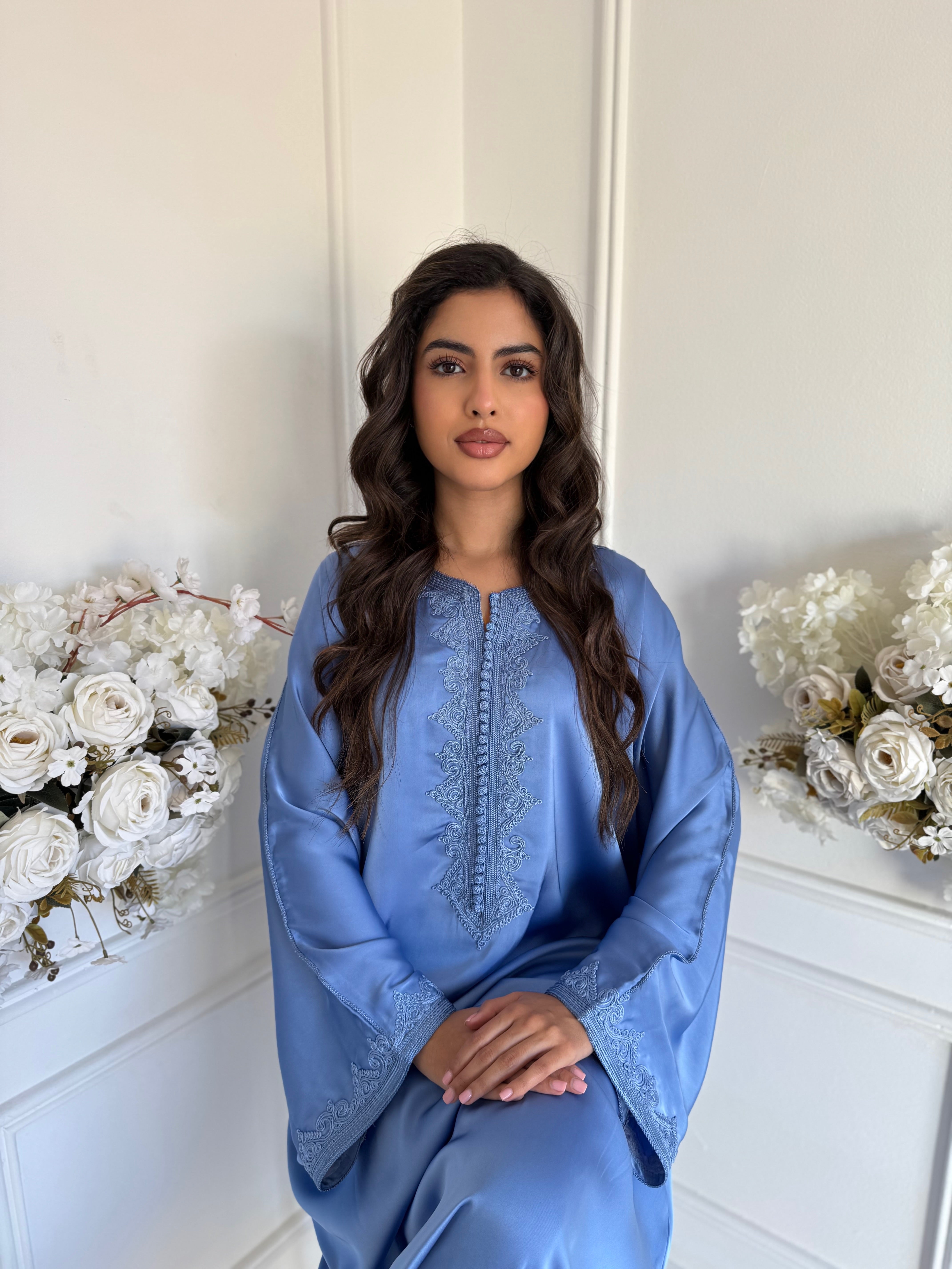 Model wearing Gandoura Roos – light blue Moroccan dress with delicate embroidery