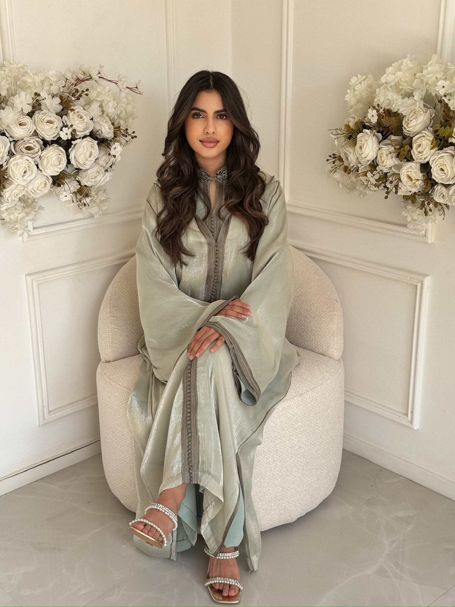 Full view of silver-green Moroccan jellaba with flowy sleeves and elegant details